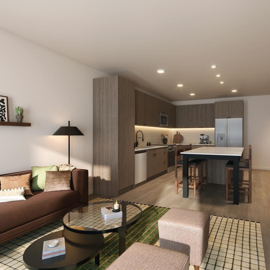 a living room with a couch and a kitchen with a table